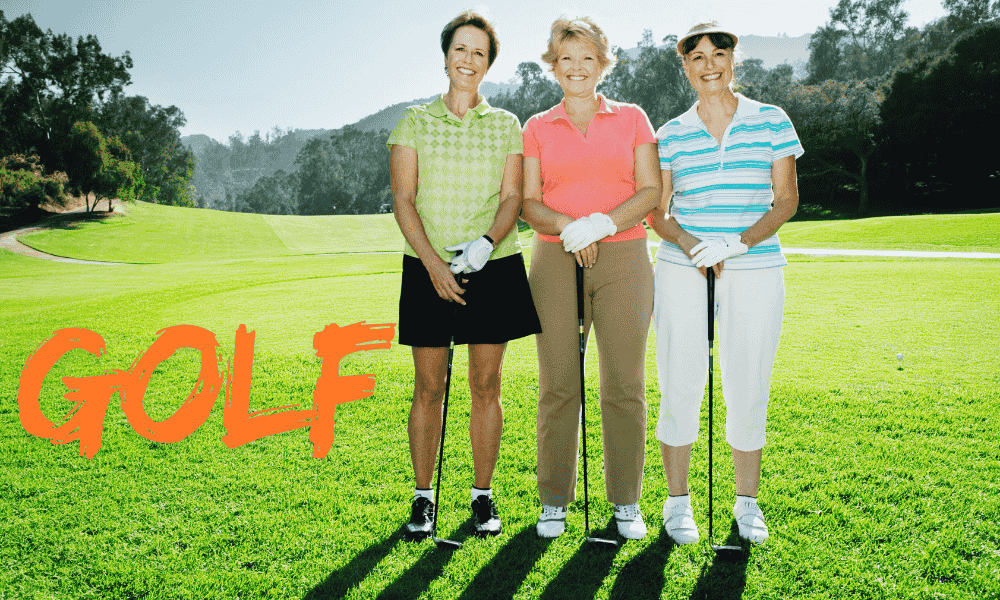 Three middle-aged women playing golf together on a sunny course