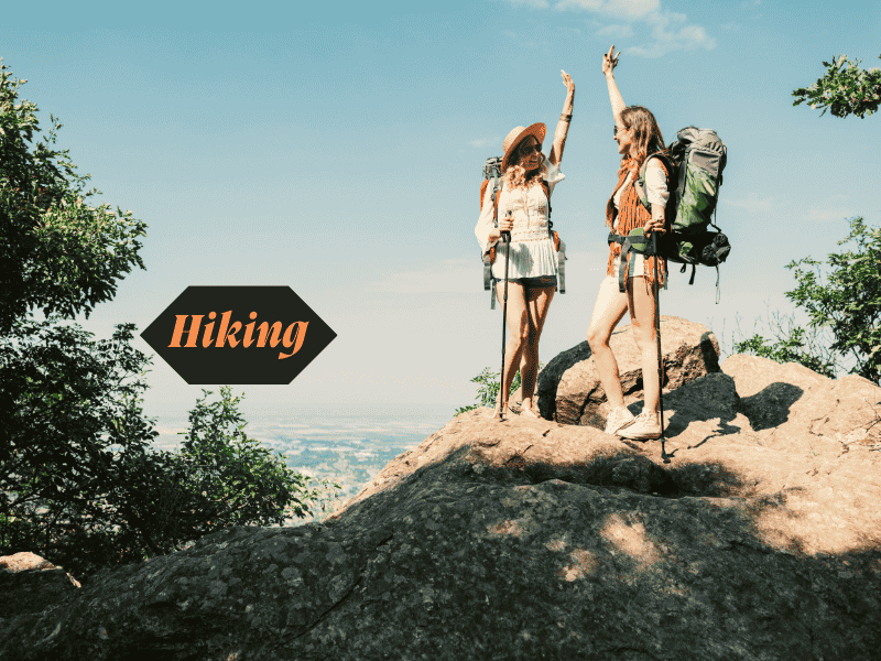 Woman in her 30s hiking on a mountain trail, enjoying an active outdoor hobby