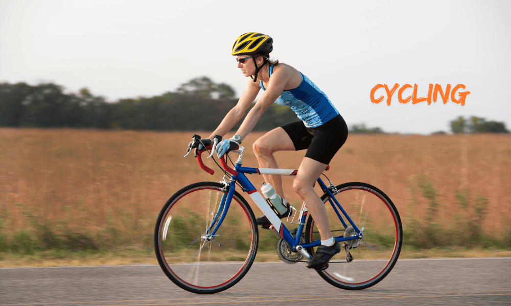 A woman cycling outdoors, enjoying road biking or mountain biking through scenic trails.