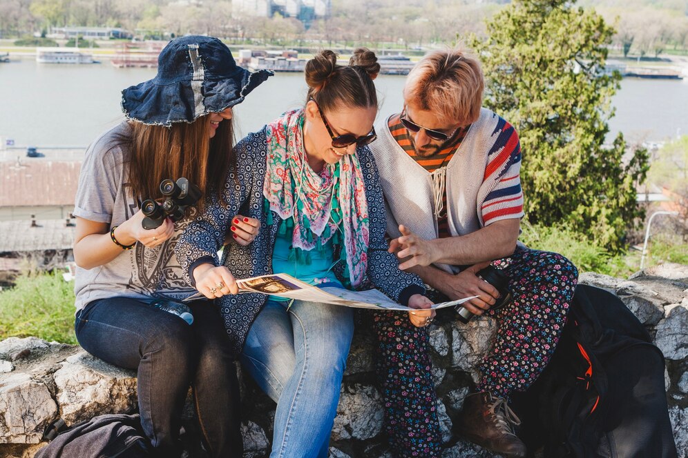 A group of women enjoying a budget-friendly travel group experience, exploring a scenic destination together—an example of cheap hobbies for women who love adventure.