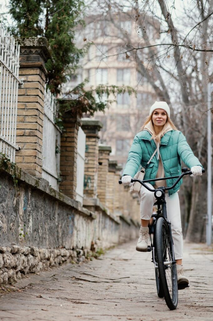 Thrilling winter hobbies for women – fat bike riding for adventure and fitness on snowy trails.