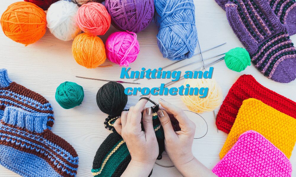 A woman knitting with yarn and needles, creating a handmade piece.