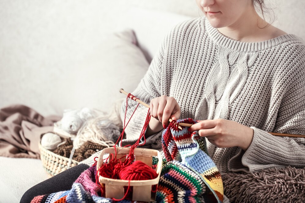 "Knitting or crocheting – one of the great hobbies for women to create handmade pieces while relaxing."