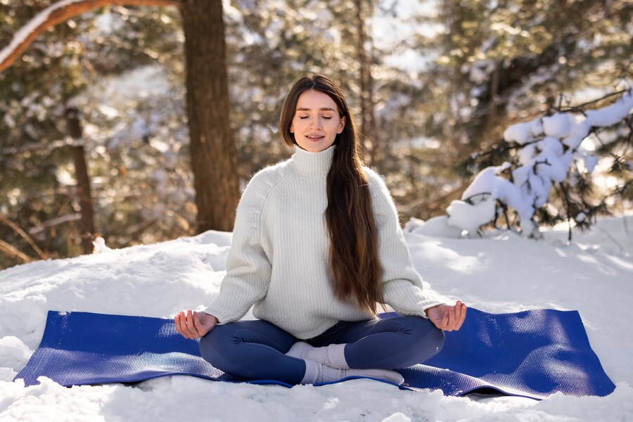 : Calming winter hobbies for women – meditation and yoga for relaxation, balance, and inner peace.