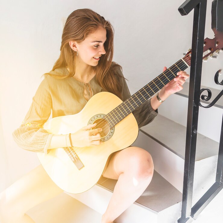 "Playing a Musical Instrument – a great hobby for women to express creativity, reduce stress, and enjoy the joy of music."