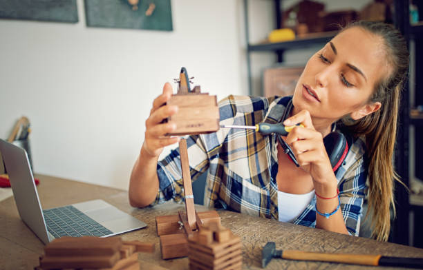 A detailed model kit in progress on a tidy workbench with tools and miniature parts — highlighting model building as a focused, solitary hobby for introverts who enjoy precision and creativity.