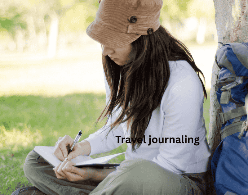 Woman travel journaling in a scenic location, capturing solo travel memories and personal reflections.