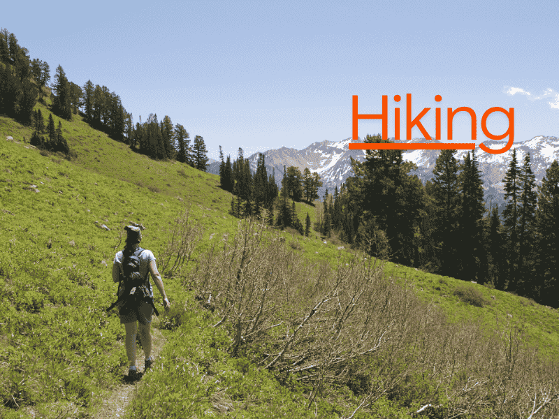 Hiking or nature walks – woman enjoying the outdoors for relaxation and mental health.