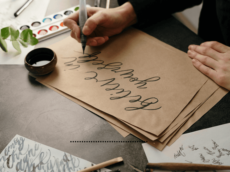 Learning calligraphy and modern lettering as a relaxing cozy hobby with pen and paper at home