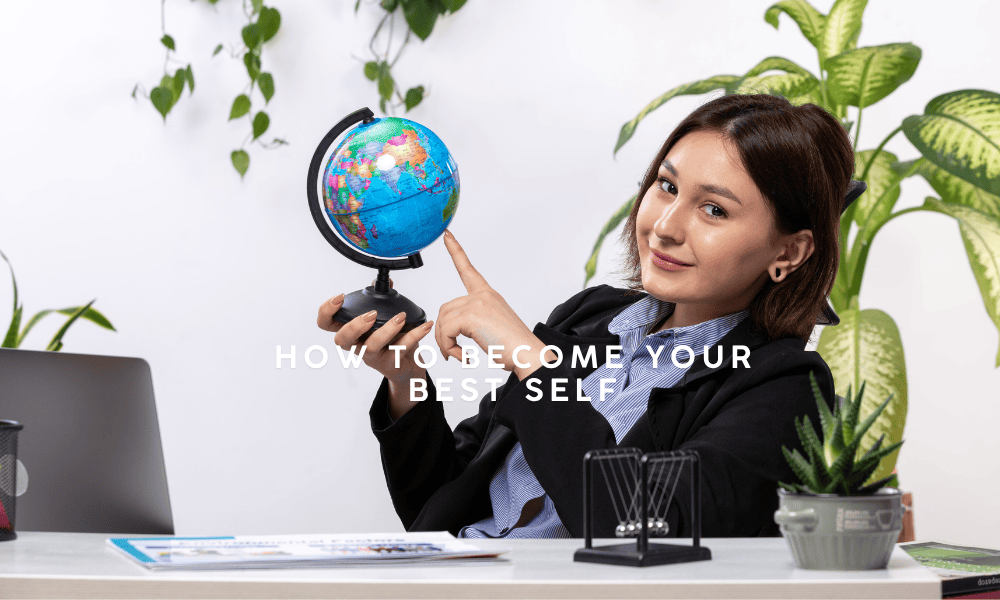 A confident woman sitting at a desk pointing at a globe, symbolizing personal growth and self-discovery — how to become your best self.