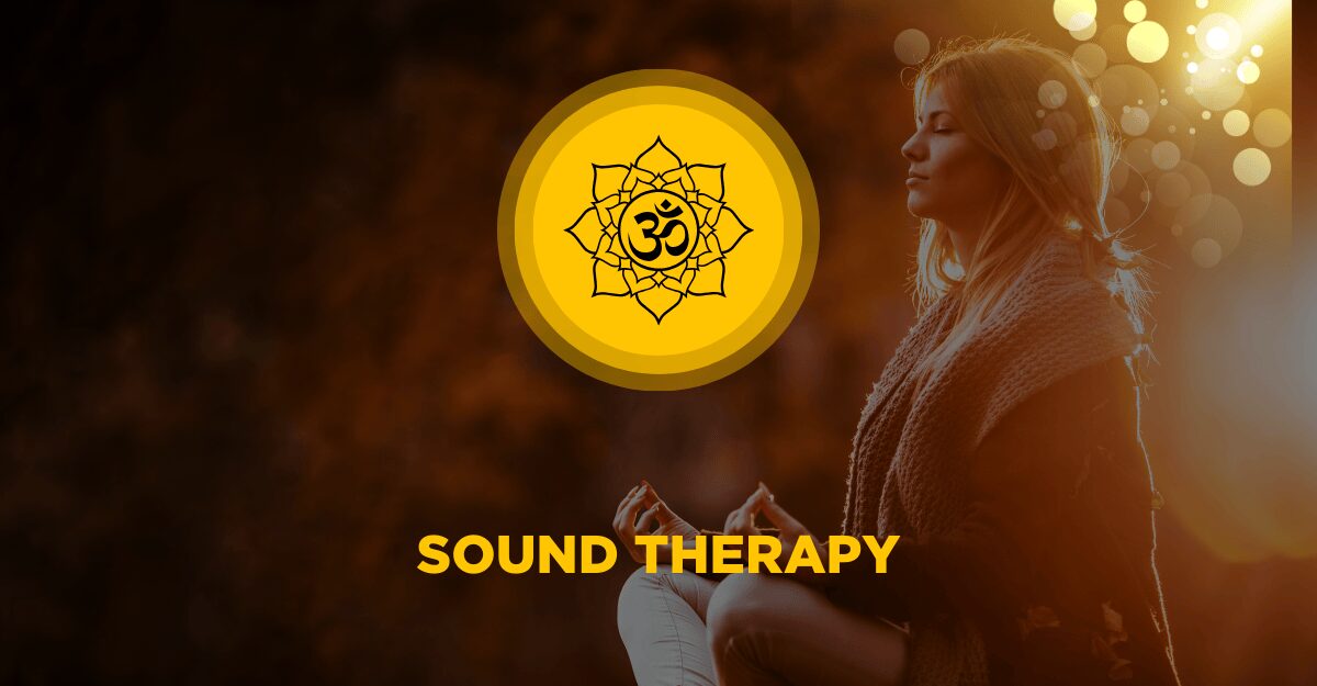 Woman meditating peacefully in warm light with an Om mandala symbol representing sound therapy and healing vibrations.