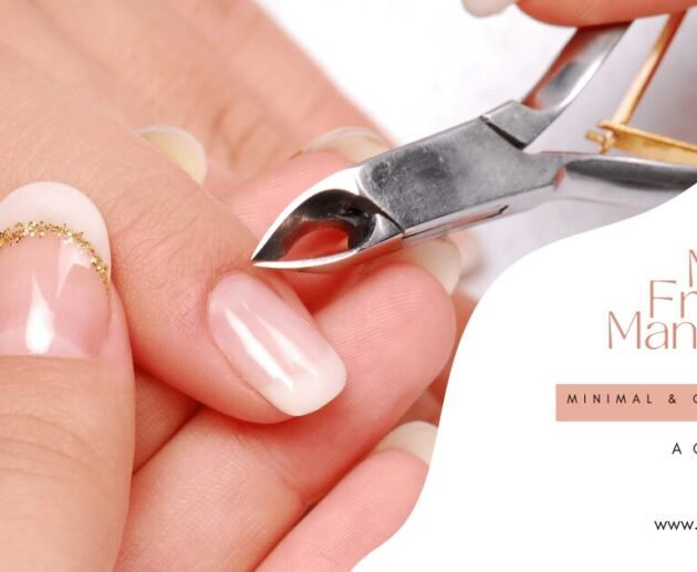 Close-up of a Micro French Manicure with minimal white tips and gold detailing during a professional nail treatment.